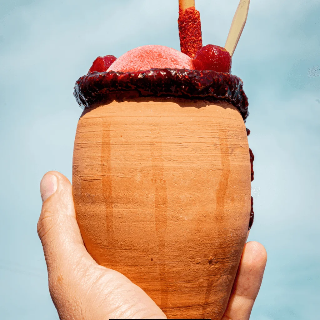 Chilled Cantarito Cocktail served in an earth pot.
