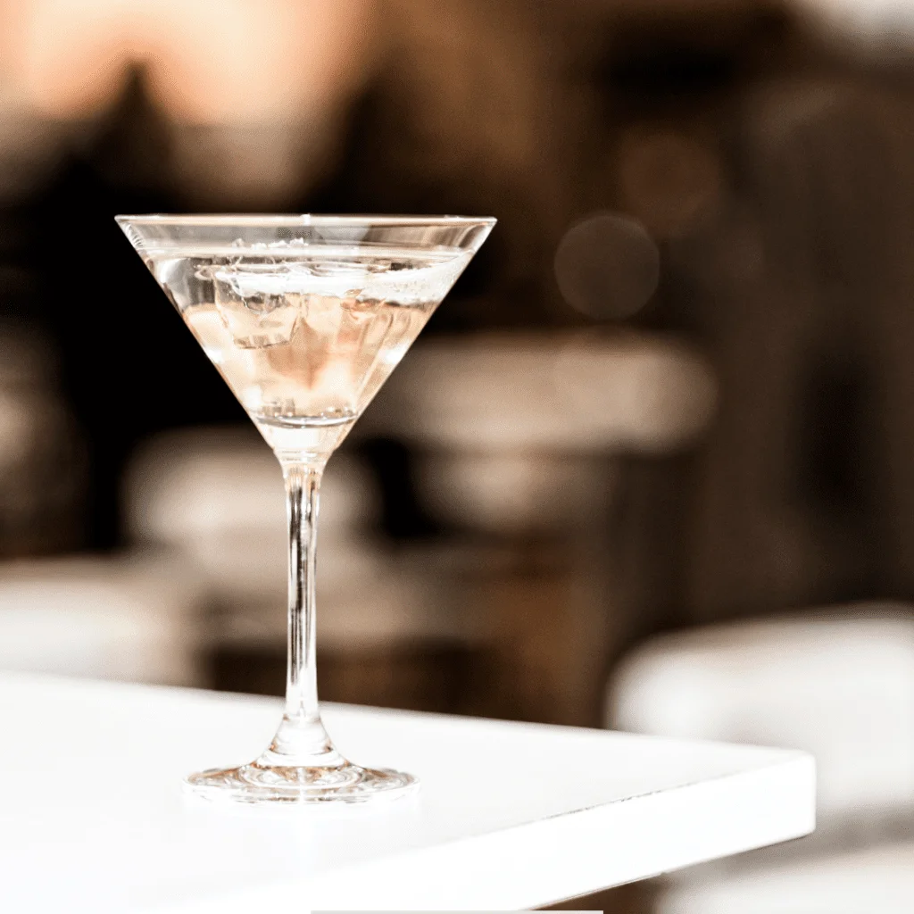 a glass of Oklahoma Martini resting on a white table