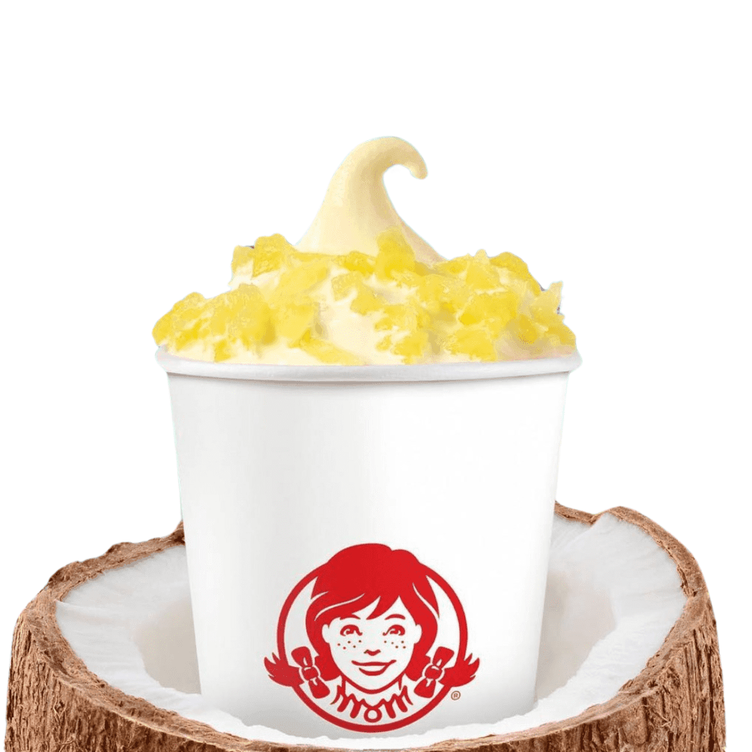 Wendy's Pineapple Frosty with whipped with pineapple toppings served on a coconut