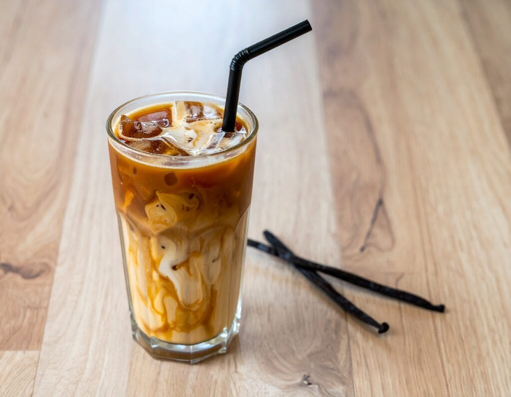Chilled Starbucks Caramel Vanilla Swirl Iced Coffee with a straw